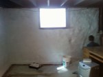 A masonry coating applied to an interior basement wall. like tuckpointing