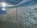 Open joints in basement stone wall ready to tuckpoint